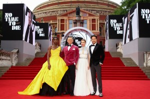 Lashana Lynch, from left, Daniel Craig, Lea Seydoux and Cary Joji Fukunaga pose for photographers upon arrival for the World premiere of the film 'No Time To Die', in London Tuesday, Sept. 28, 2021. (Photo by Joel C Ryan/Invision/AP)