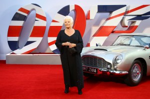 Dame Judi Dench poses for photographers upon arrival for the World premiere of the new film from the James Bond franchise 'No Time To Die', in London Tuesday, Sept. 28, 2021. (Photo by Joel C Ryan/Invision/AP)