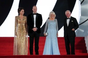 Britain's Prince Charles, from right, his wife Camilla the Duchess of Cornwall, Britain's Prince William and his wife Kate the Duchess of Cambridge pose for photographers upon arrival for the World premiere of the new film from the James Bond franchise 'No Time To Die', in London Tuesday, Sept. 28, 2021. (AP Photo/Matt Dunham)