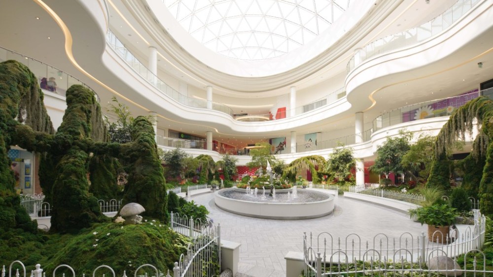 The lush garden area beneath the skylight.