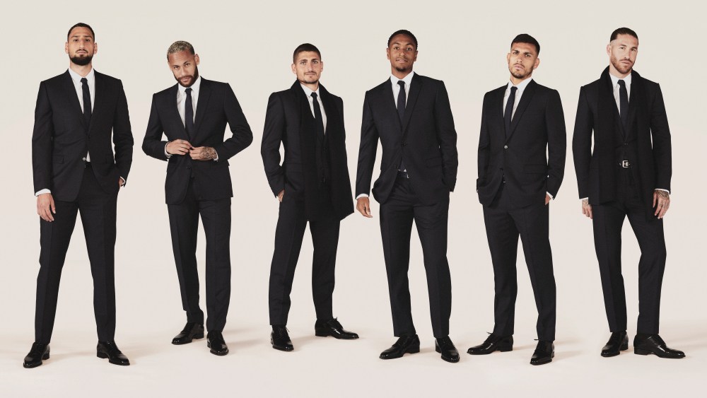 Gianluigi Donnarumma, Neymar Jr., Marco Verratti, Abdou Diallo, Leandro Paredes and Sergio Ramos wearing formal Doir outfits.