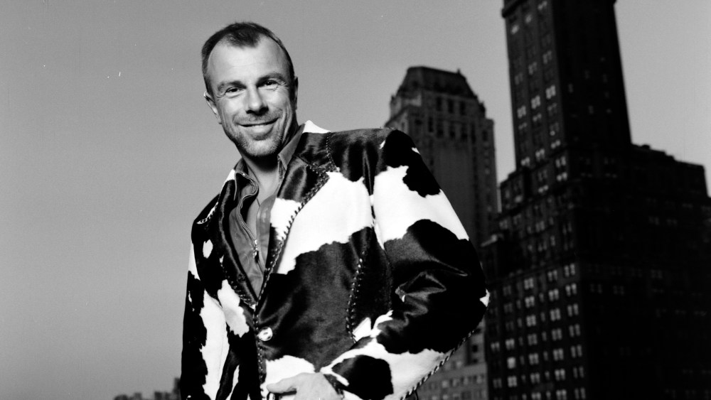 Designer Thierry Mugler in his signature leather pants poses for portraits on the balcony of his New York City showroom on September 20, 1993.