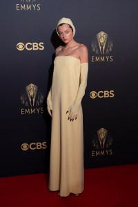Emma Corrin poses for photographers as she arrives for the Netflix Celebration of the 73rd Primetime Emmy Awards in central London, Sunday, Sept. 19, 2021. (Photo by Joel C Ryan/Invision/AP)