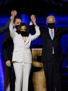 FILE - In this Saturday, Nov. 7, 2020, file photo, from left, Doug Emhoff, husband of Vice President-elect Kamala Harris, Harris, President-elect Joe Biden and his wife, Jill Biden, stand on stage together, in Wilmington, Del. The theme for Biden’s inauguration will be “America United." Unity is an issue that’s long been a central focus for Biden but one that’s taken on added weight in the wake of the violence at the U.S. Capitol. (AP Photo/Andrew Harnik, Pool, File)