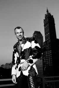 Thierry Mugler in his signature leather pants on the balcony of his New York City showroom on September 20, 1993.