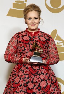 Adele. Adele poses backstage with the award for best pop solo performance for "Set Fire to the Rain" at the 55th annual Grammy Awards on Sunday, Feb. 10, 2013, in Los Angeles. (Photo by Matt Sayles/Invision/AP) URN:15766494
