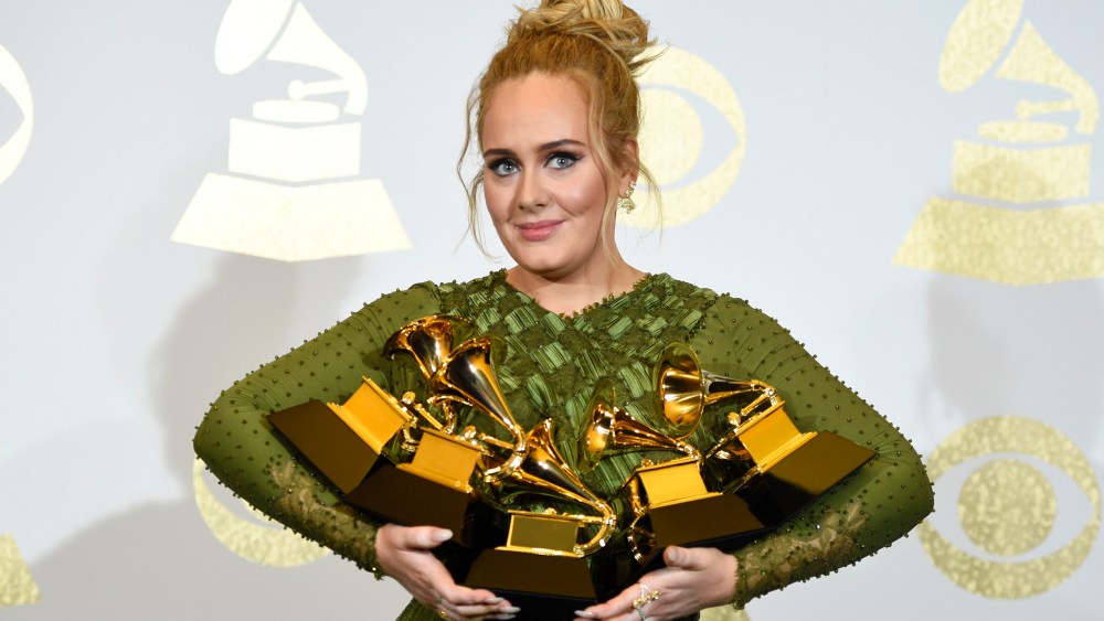 FILE - Adele poses in the press room with the awards for album of the year for "25", song of the year for "Hello", record of the year for "Hello", best pop solo performance for "Hello", and best pop vocal album for "25" at the Grammy Awards in Los Angeles on Feb. 12, 2017. Adele announced on Instagram that her “30” album will come out November 19. A new single, ‘Easy on Me,’ is being released on Friday.(Photo by Chris Pizzello/Invision/AP, File)