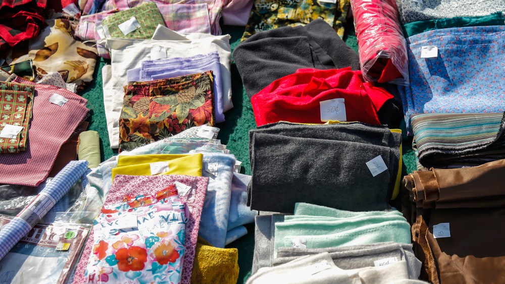 In this June 27, 2014, 2014 photo, fabric is seen priced at a garage sale at Linda Burton's home in Joliet,Ill. Fabric is usually high-priced in stores can be a real bargain at garage sales. (AP Photo/The Herald-News, Lathan Goumas)  MANDATORY CREDIT