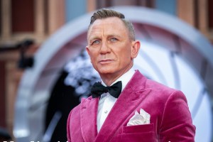 Daniel Craig wore a bright pink jacket to the long-delayed world premiere of “No Time To Die,” inspiring a 46 percent increase in searches for velvet blazers and formal jackets, Lyst said.