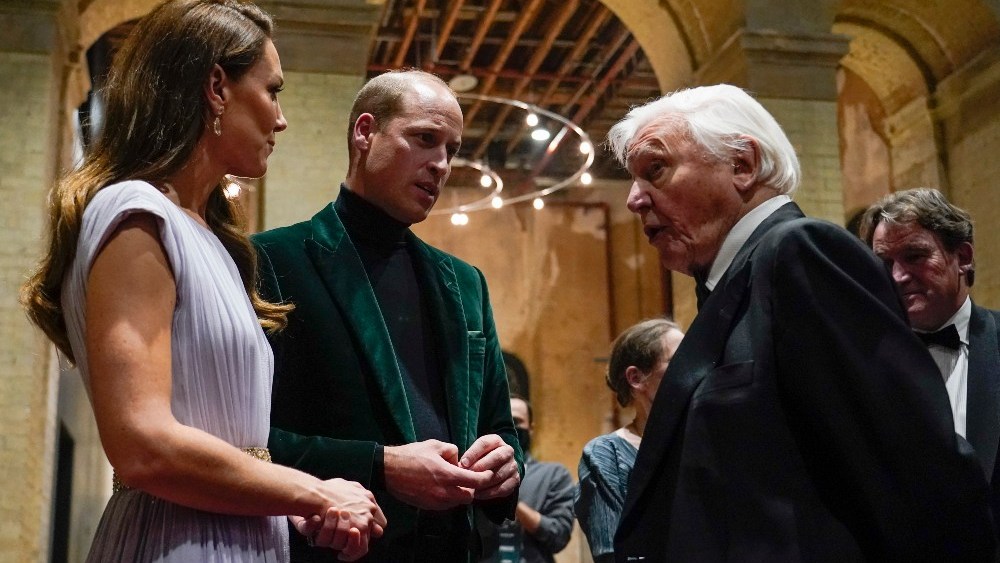 Prince William—seen here betweeen Kate, Duchess of Cambridge, and David Attenborough, the royal's collaborator in creating the Earthshot Awards—rewore a green velvet Reiss blazer Sunday.