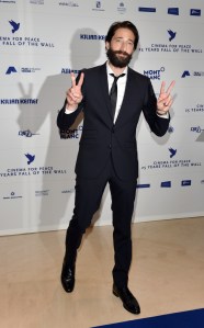 Adrian Brody arrives for the 'Cinema for Peace Heroes Gala Dinner' at the Adlon Hotel in Berlin, Germany, 2014.