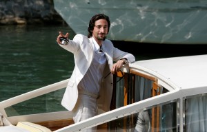 Adrien Brody waves from a boat at Venice Lido where he presents "The Darjeelin Limited" at the 64th edition of the Venice Film Festival, 2007.