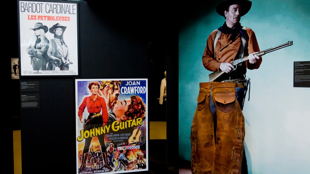 A vignette showing cowboys - and cowgirls.