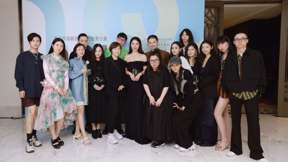 Wendy Yu (center), Madame Lv, secretary general of Shanghai Fashion Week and the inaugural finalists.