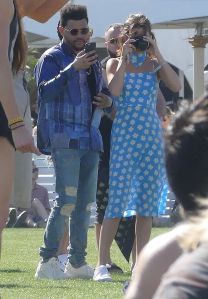 Selena Gomez and The Weeknd got intimate while watching a show at Coachella on Saturday. The it-couple were walking hand-in-hand, shared an intimate kiss and got an ice-cream on a beautiful spring day at the famed music festival. 15 Apr 2017 Pictured: Selena Gomez, The Weeknd. Photo credit: MEGA TheMegaAgency.com +1 888 505 6342 (Mega Agency TagID: MEGA29799_020.jpg) [Photo via Mega Agency]