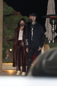 Kourtney Kardashian and Travis Barker grab dinner at Nobu Malibu in Malibu. Kourtney also brought her son Mason along to dinner. 25 Mar 2021 Pictured: Kourtney Kardashian and Travis Barker. Photo credit: Photographer Group/MEGA TheMegaAgency.com +1 888 505 6342 (Mega Agency TagID: MEGA742322_001.jpg) [Photo via Mega Agency]