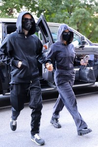 Kourtney Kardashian and Travis Barker seen holding hands while arriving at their hotel in NYC. 11 Sep 2021 Pictured: Kourtney Kardashian and Travis Barker. Photo credit: MEGA TheMegaAgency.com +1 888 505 6342 (Mega Agency TagID: MEGA786127_004.jpg) [Photo via Mega Agency]