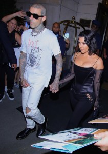 Kourtney Kardashian holds hands with Travis Barker at their NYC fashion week debut as a couple as they head to Carbone for dinner on 9/11 20th Anniversary. 12 Sep 2021 Pictured: Kourtney Kardashian, Travis Barker. Photo credit: Brian Prahl/MEGA TheMegaAgency.com +1 888 505 6342 (Mega Agency TagID: MEGA786330_008.jpg) [Photo via Mega Agency]