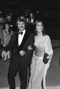 Sonny Bono and Cher wearing a sheer two piece outfit arriving at the 45th annual Academy Awards