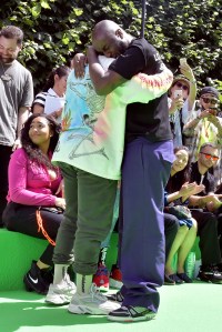 Kanye West and Virgil Abloh embrace in the front row of Abloh's first show as Artistic Director of Louis Vuitton