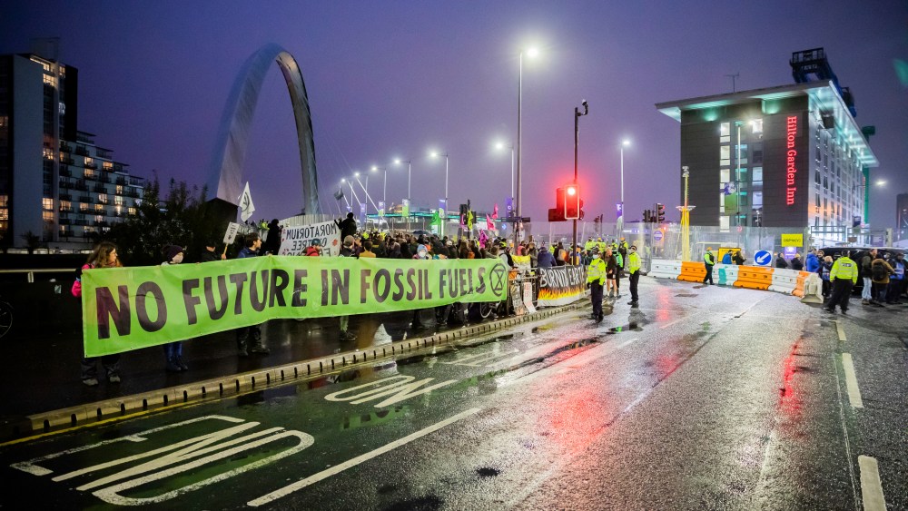 08 November 2021, United Kingdom, Glasgow: People protest for better climate protection on the sidelines of the UN Climate Change Conference COP26 in Glasgow. A banner reads "No future in fossil fuels". For two weeks, around 200 countries in Glasgow are struggling to find a way to achieve the goal of limiting global warming to 1.5 degrees compared to pre-industrial times. Photo by: Christoph Soeder/picture-alliance/dpa/AP Images