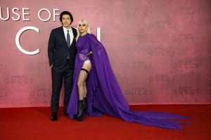 Lady Gaga, right, and Adam Driver pose for photographers upon arrival at the World premiere of the film 'House of Gucci' in London Tuesday, Nov. 9, 2021. (Photo by Vianney Le Caer/Invision/AP)