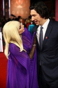Adam Driver, right, and Lady Gaga pose for photographers upon arrival at the World premiere of the film 'House of Gucci' in London Tuesday, Nov. 9, 2021. (Photo by Joel C Ryan/Invision/AP)