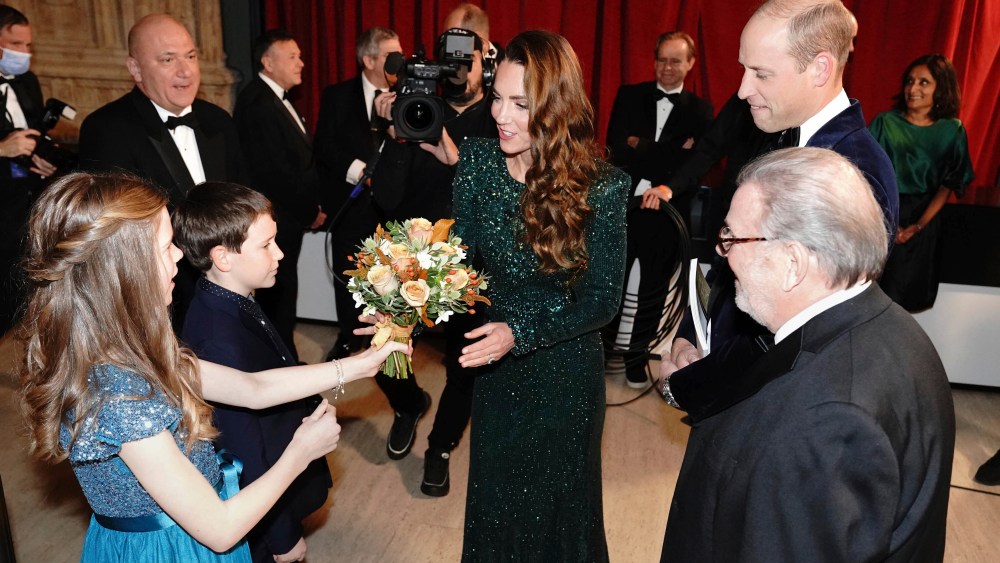 Britain's Kate, Duchess of Cambridge is given a posy during the Royal Variety Performance at the Royal Albert Hall, London, Thursday, Nov. 18, 2021. (Jonathan Brady/Pool Photo via AP)