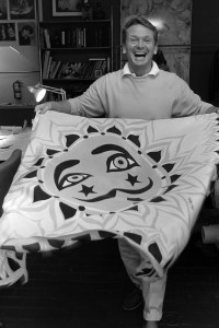 American costume and fashion designer Bob Mackie displays a sample from his new line of hand-painted scarves at his New York City Studio on October 1, 1986.
