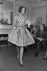 A model wearing a striped dress in the Ray Aghayan and Bob Mackie Spring/Summer Ready to Wear 1973 show in New York