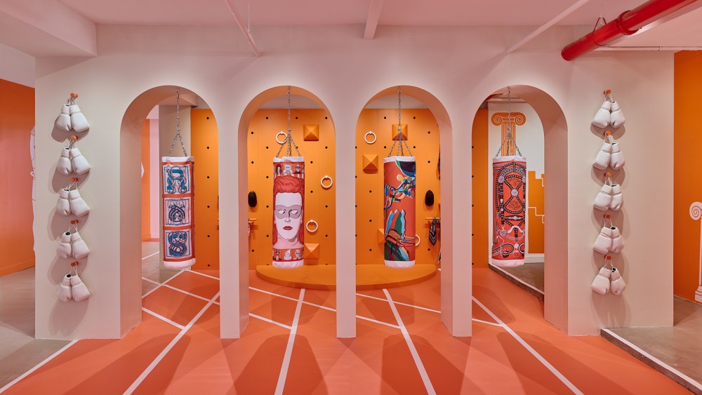 Boxing bags printed with Hermès scarf motifs at the HermèsFit installation in Brooklyn.