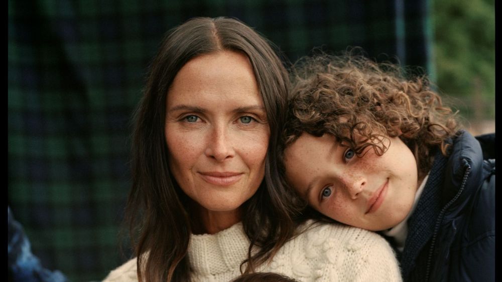 A past Ralph Lauren holiday campaign  featuring a family wearing white and navy sweaters.