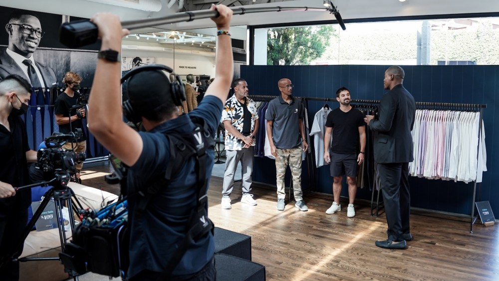Front Office host Wale Ogunleye and the entrepreneurs at an Indochino showroom.