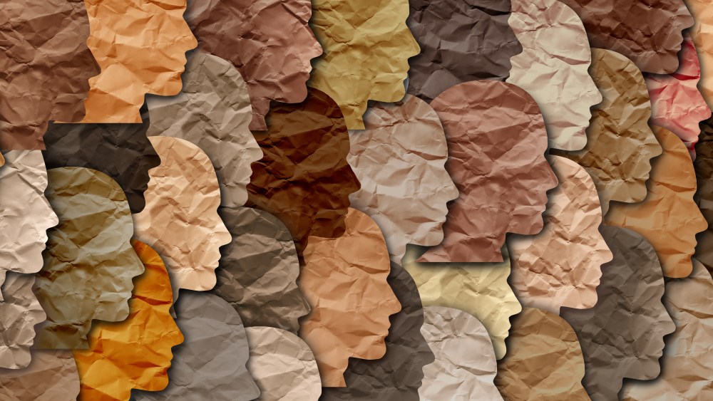 artistic image of multi-colored, multi cultural faces representing diversity