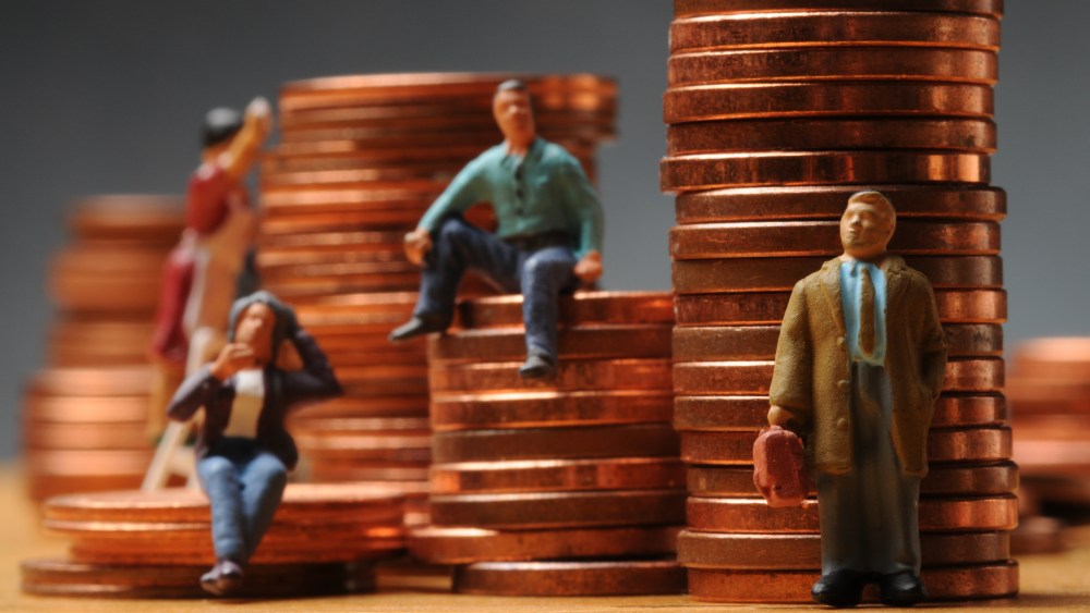 figurines on stacks of pennies