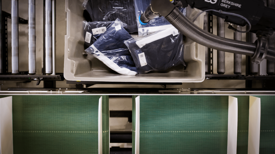 An overhead view of a robot picking apparel for Berkshire Grey's Robotic Product Sortation system.