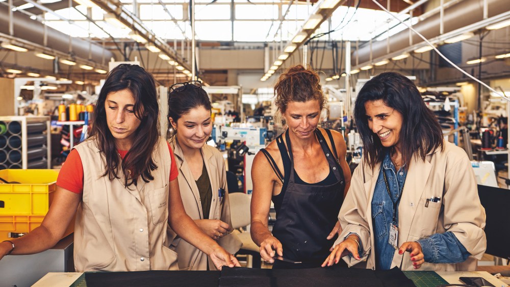 Leather goods workers in Louis Vuitton's Ateliers de la Drôme workshop.