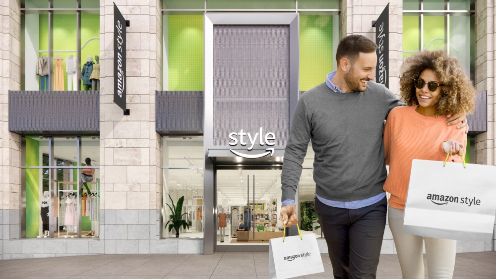 man and woman shoppers outside amazon style store bag
