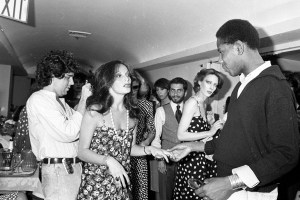 Andre Leon Talley backstage with designer Diane von Furstenberg after her Fall 1977 RTW collection runway show.