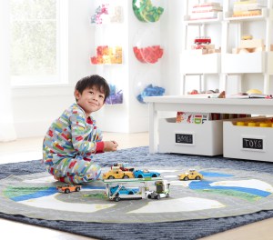 The toy brand known for its colorful bricks brings its playful style to a new Pottery Barn Kids line of bedding, sleepwear and more.