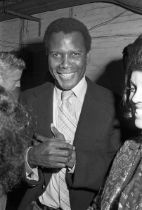 Sidney Poitier wearing a suit at the "Harlem Homecoming" benefit for Arthur Mitchell's Dance Theater of Harlem, 1972.
