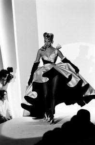Model Emma Sjoberg poses in evening wear from designer Thierry Mugler's debut Couture Fall 1992 runway show.