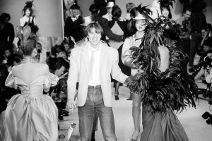 Thierry Mugler takes a bow on the runway after a show with model Pat Cleveland at his 1982 RTW show.