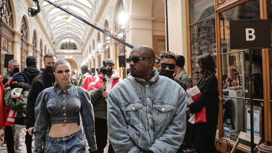 Searches for double denim have spiked following photos showing Ye and Julia Fox in matching Canadian tuxedos at Paris Fashion Week.