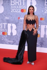 Maya Jama poses for photographers upon arrival at the Brit Awards 2022 in London Tuesday, Feb. 8, 2022. (Photo by Joel C Ryan/Invision/AP)