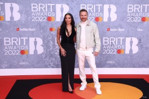 David Guetta, right, and Jessica Ledon pose for photographers upon arrival at the Brit Awards 2022 in London Tuesday, Feb. 8, 2022. (Photo by Joel C Ryan/Invision/AP)