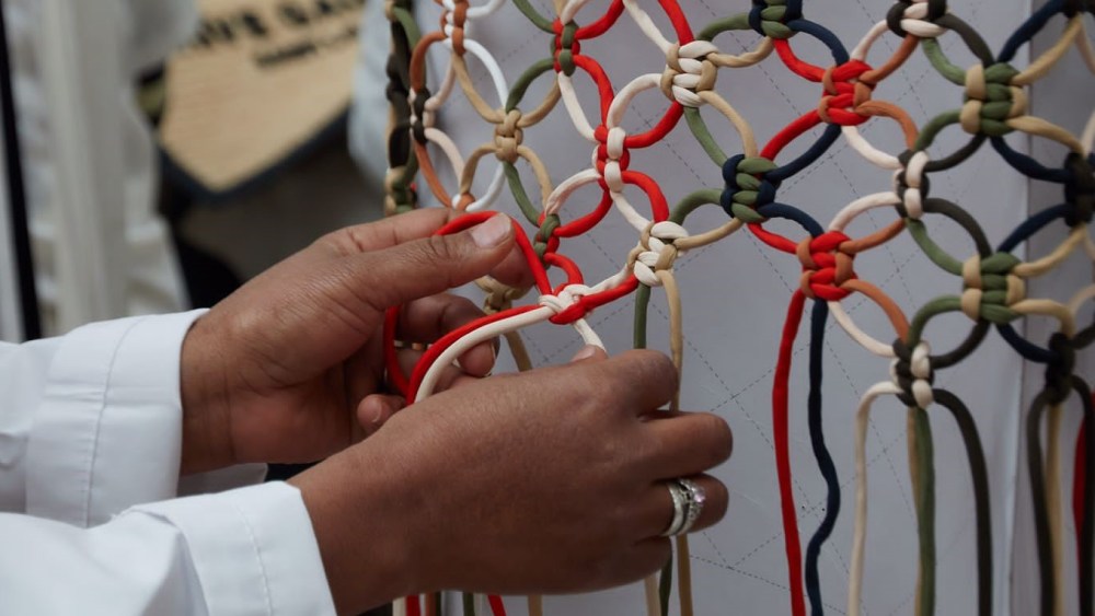 Artisans from Akanjo in Madagascar work on a design for Chloé.