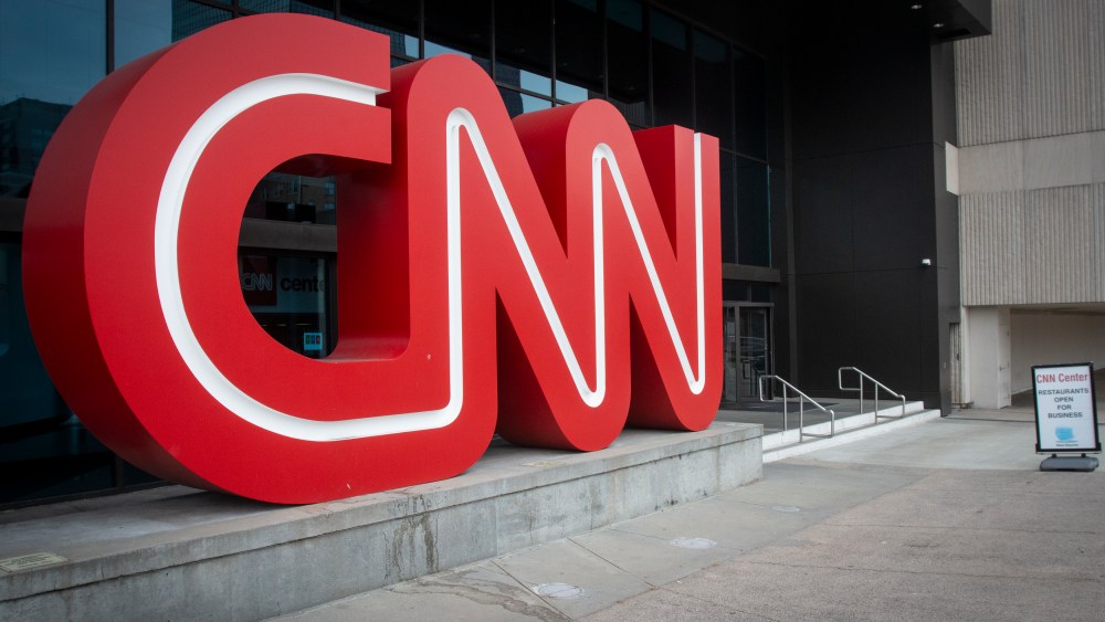 The CNN logo is displayed at the entrance to the CNN Center in Atlanta on Wednesday, Feb. 2, 2022. CNN President Jeff Zucker has abruptly resigned Wednesday after acknowledging a consensual relationship with another network executive. (AP Photo/Ron Harris)