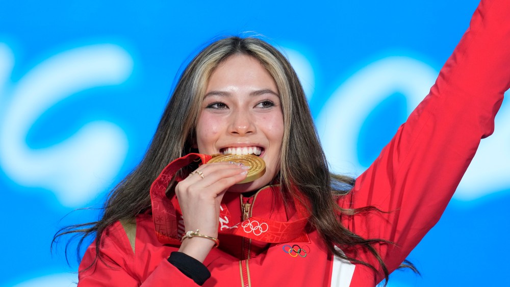 Gold medalist Eileen Gu of China celebrates during the medal ceremony for the women's freestyle skiing big air at the 2022 Winter Olympics.
