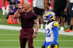 Actor Dwayne Johnson announces the start of the NFL Super Bowl 56 football game between the Cincinnati Bengals and the Los Angeles Rams Sunday, Feb. 13, 2022, in Inglewood, Calif. (AP Photo/Ted S. Warren)